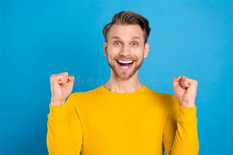 Photo of Young Guy Happy Positive Smile Rejoice Victory Lucky Success Fists Hands Isolated Over ...