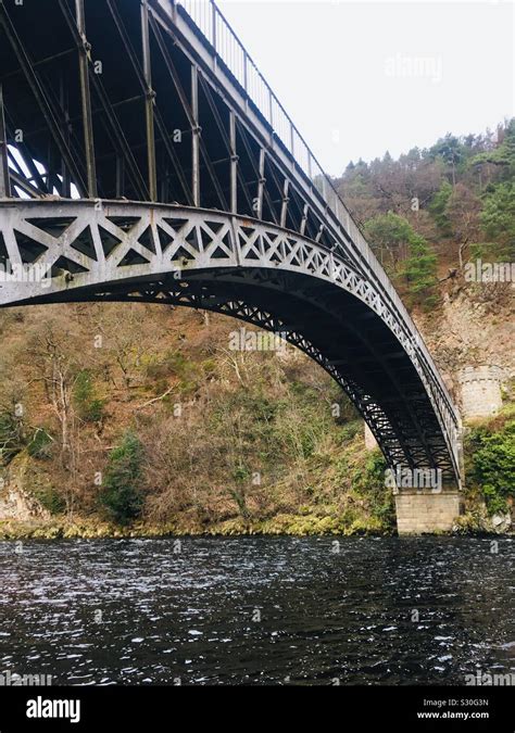 The 151 foot arch of Craigellachie Bridge. A cast iron arch bridge across the River Spey built ...