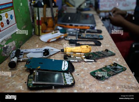 A mobile phone (cellphone) shop and repair workshop in Mumbai, India ...