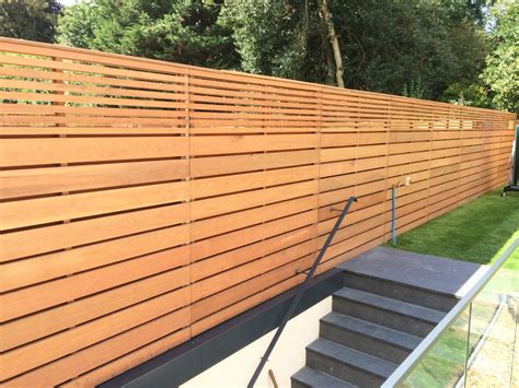 Cedar horizontal slatted garden fencing | Fence design, Garden fence ...