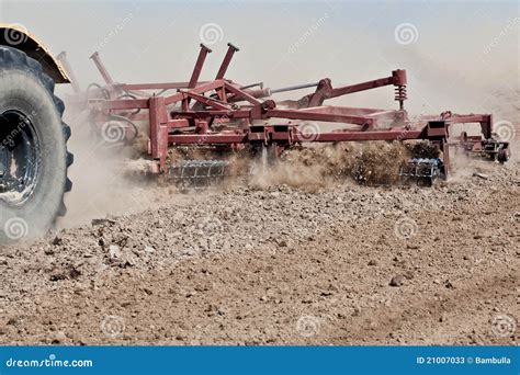 Harrowing a field stock image. Image of combine, golden - 21007033