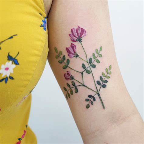 Violet flower tattoo - Tattoogrid.net