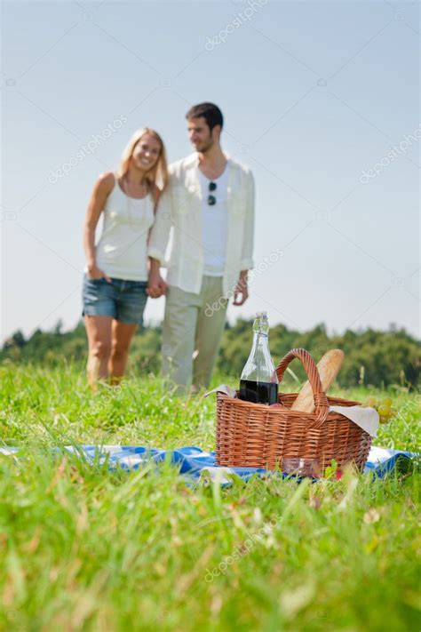 Picnic basket - Romantic couple holding hands — Stock Photo © CandyBoxImages #7085535