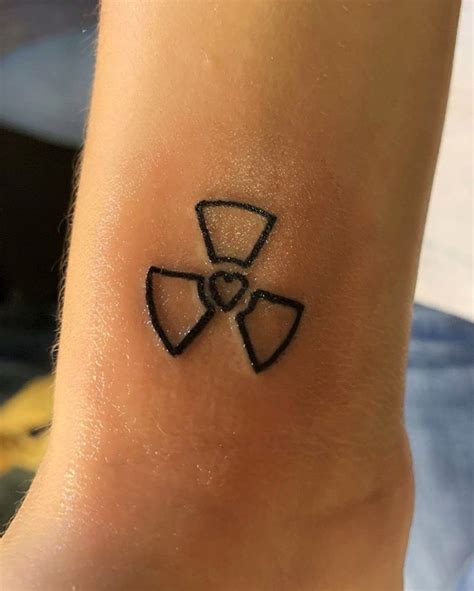 Radiation Caution Symbol with Heart Tattoo | Tech tattoo, Medical tattoo, Small tattoos