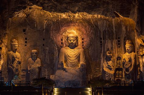 Ancient Buddha statues shine under modern lights at night - CGTN