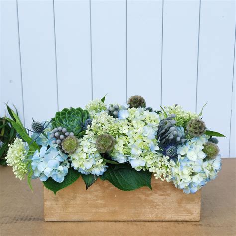 Nantucket Blues... hydrangea, succulent and thistle arrangement in a gold wooden box by Soire ...