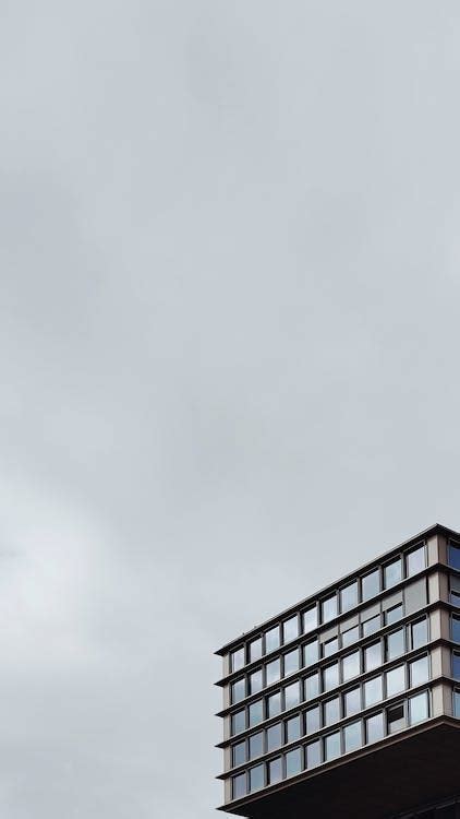 A Building under a Cloudy Sky · Free Stock Photo