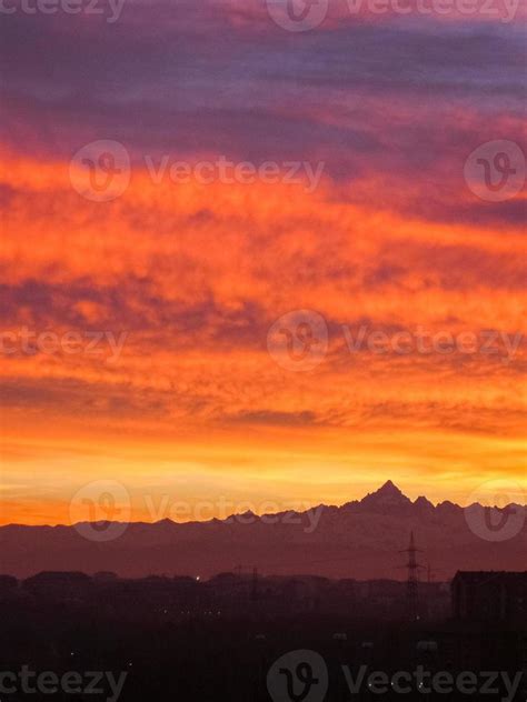 Red sunset with clouds and mountains skyline 7020213 Stock Photo at ...