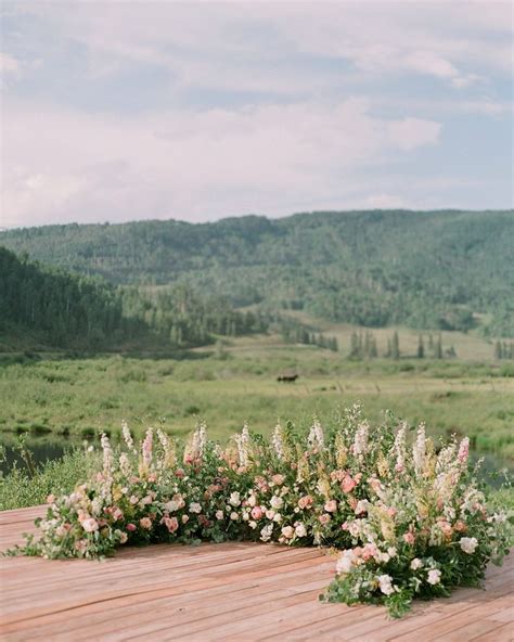 A Wedding Ceremony Trend We're Loving: Grounded Floral Arches | Wedding ...