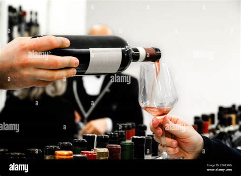 Tasting experience with a glass of Barolo wine in Alba (Piedmont, Italy Stock Photo - Alamy