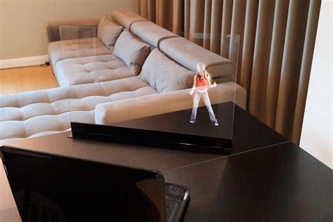 Transparent screen displays free-floating "holograms" in your home