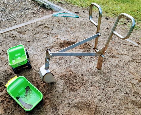 Stand & Dig Playground Digger. Also works with wheel chair platform. www.SandboxDigger.com or ...