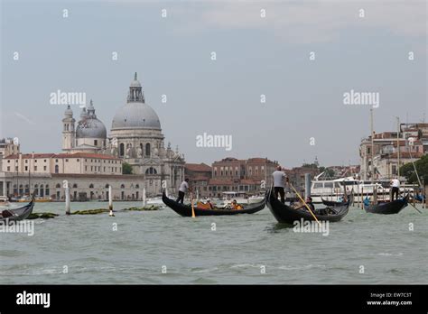 Tourist gondola ride in the lagoon outside St Mark's Square, Venice ...