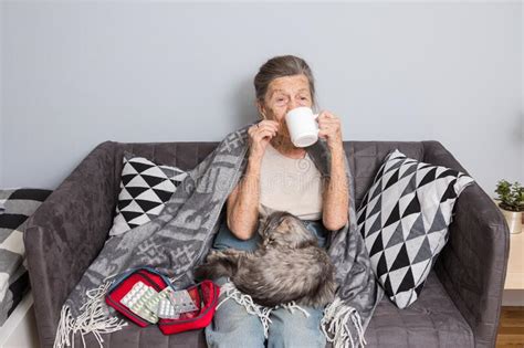 Elderly Woman with Pills at Home. Senior Woman Holding Glass of Water ...