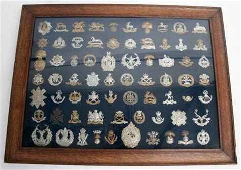 Framed Display of Sixty Nine British Regimental Cap Badges mostly of ...