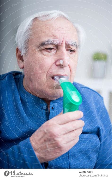 Senior man using nebuliser - a Royalty Free Stock Photo from Photocase