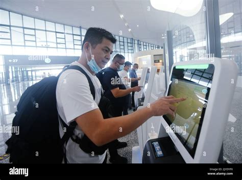 HANGZHOU, CHINA - SEPTEMBER 8, 2022 - Passengers check in at the ...