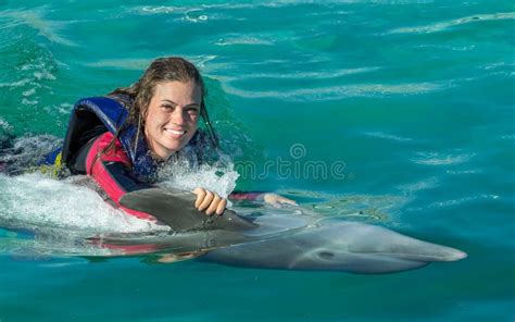 Smiling Woman Swimming with Dolphin. Stock Photo - Image of cuba ...