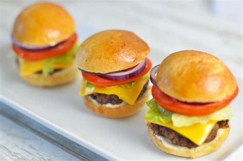 Sliders - mini burgers with beef, cheese, tomato, red onion and lettuce