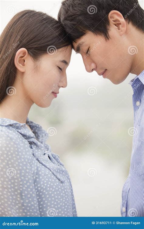 Young Couple Touching Foreheads Stock Image - Image of face, beijing ...