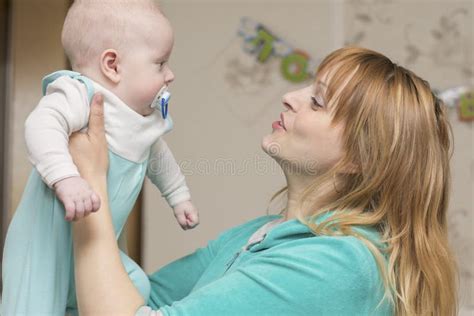 Mom plays with baby stock image. Image of family, newborn - 113923449