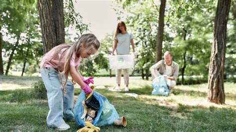 Clean Up Day with Family. Cute Little Girl Holding Trash Bag and ...