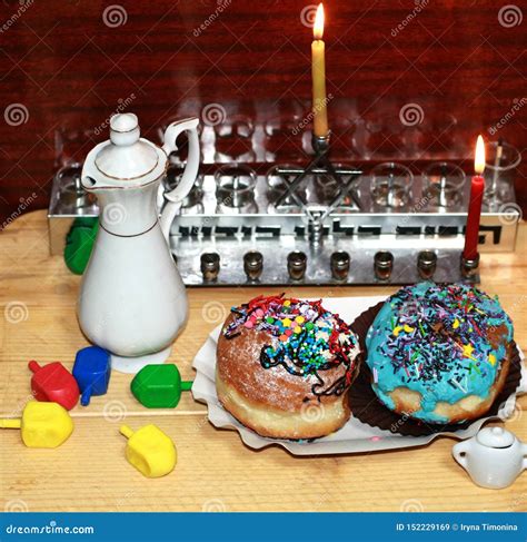 Beautiful Multicolored Hanukkah Donuts. Pastry Decoration on Donuts. Chanukia, Sevivon, Dreidl ...