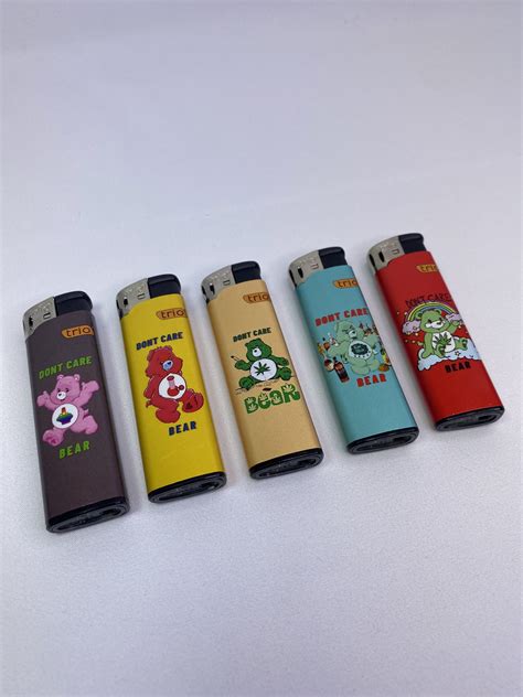 Don't Care Bear Refillable Lighters Assorted Designs - East Coast Bongs