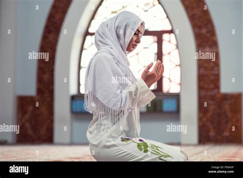 Arabic Young muslim woman praying in mosque Stock Photo - Alamy