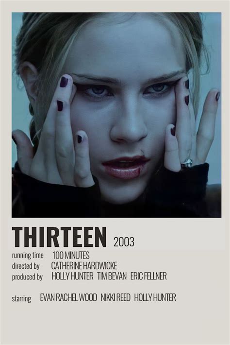 a woman with her hands on her face in front of an advertisement for the film thirteen