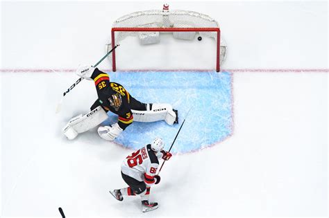 The Hughes brothers had a historic night on the ice, playing in the same game for the first time ...