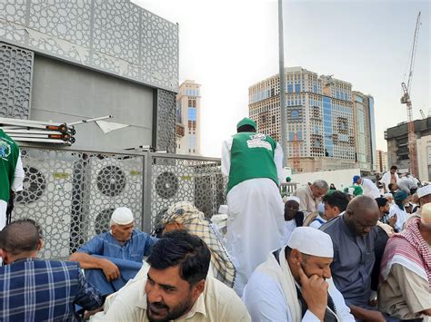 Mecca, Saudi Arabia, April 2023 - Pilgrims from different countries around the world are busy ...