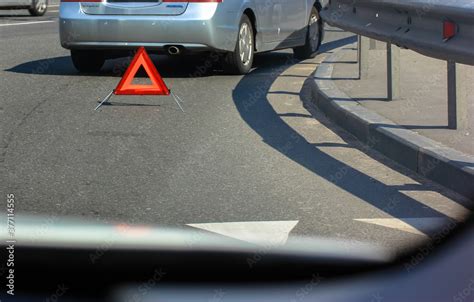 Road traffic accident: emergency stop sign, retroreflective red triangle Stock Photo | Adobe Stock