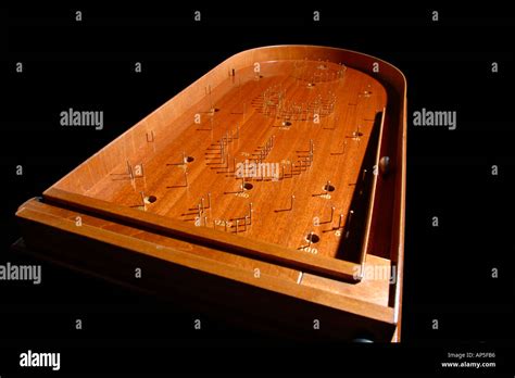 Traditional wooden bagatelle game Stock Photo - Alamy