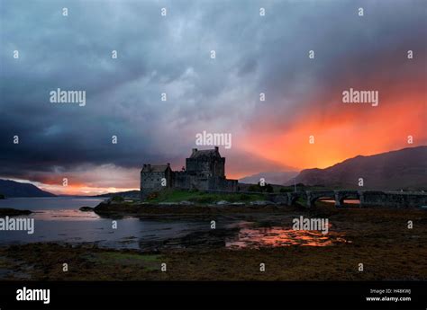 Eilean Donan Castle Kyle of Lochalsh Scotland stormy weather sunset Stock Photo - Alamy