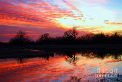 Calming Sunset Photograph by Larry Keahey