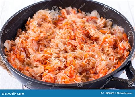 The Process of Cooking Stewed Cabbage with Carrots and Spices in a Frying Pan Stock Photo ...