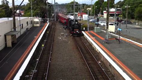 Steam train racing past Ringwood station - YouTube