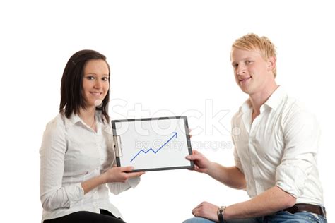 Young Businesspeople Presenting Chart Stock Photo | Royalty-Free ...