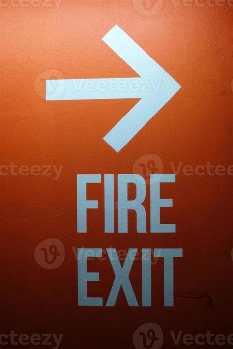 Fire Exit Sign on Red Concrete Wall Background. 19806002 Stock Photo at Vecteezy