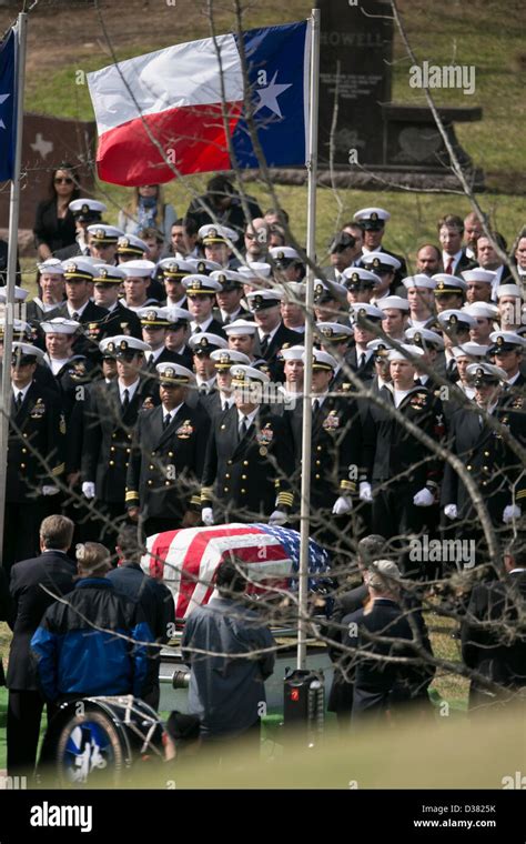 Members of U.S. Navy SEAL Team Ten stand at attention during funeral ...