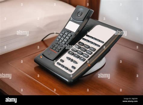 Modern telephone in hotel room Stock Photo - Alamy