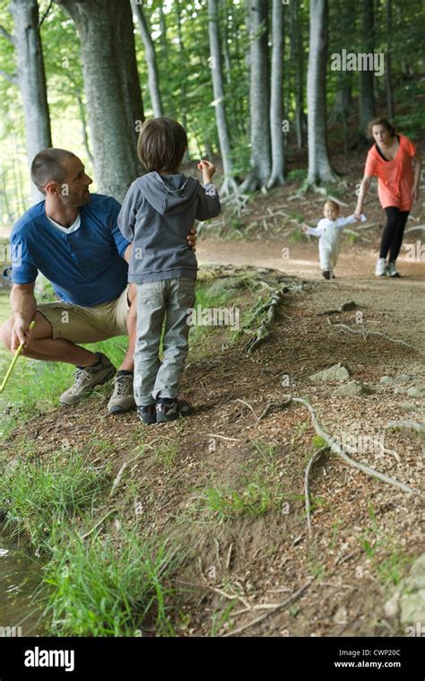 Family in woods Stock Photo - Alamy