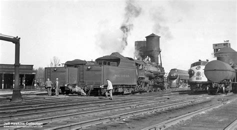 Old Black and White Photo of Trains on Tracks