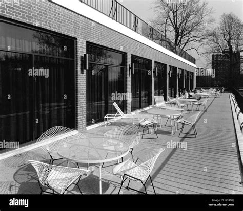 Outside of the Milton S Eisenhower Library at Johns Hopkins University, a terrace with tables ...