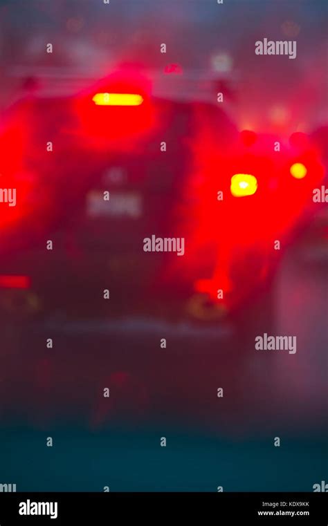 Blurred image of a car driving in the rain at night Stock Photo - Alamy