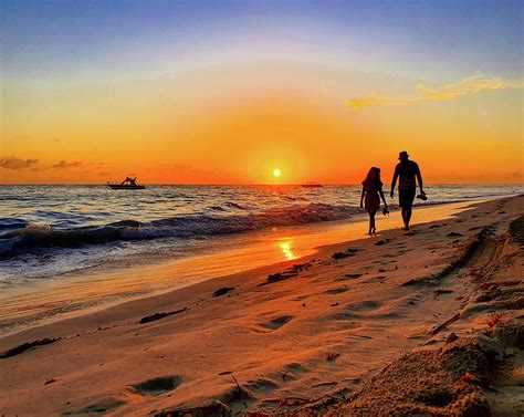 Couple walking on the beach Photograph by Valentina Sandu - Fine Art ...