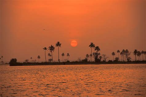 sunset along the Malabar coast in the backwaters of Kerala, India ...