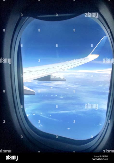 Window seat view on a plane Stock Photo - Alamy