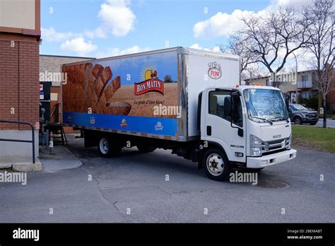 Bread truck delivery restocking restaurant in Montreal Stock Photo - Alamy